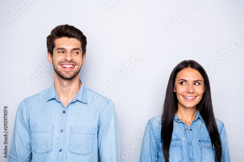 Close-up portrait of his he her she nice attractive lovely lovable charming cute cheerful cheery couple partners wearing casual looking at each other isolated over light white pastel color background
