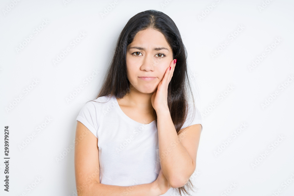 Beautiful brunette woman over isolated background thinking looking tired and bored with depression problems with crossed arms. Beautiful brunette woman over isolated background thinking looking tired and bored with depression problems with crossed arms.