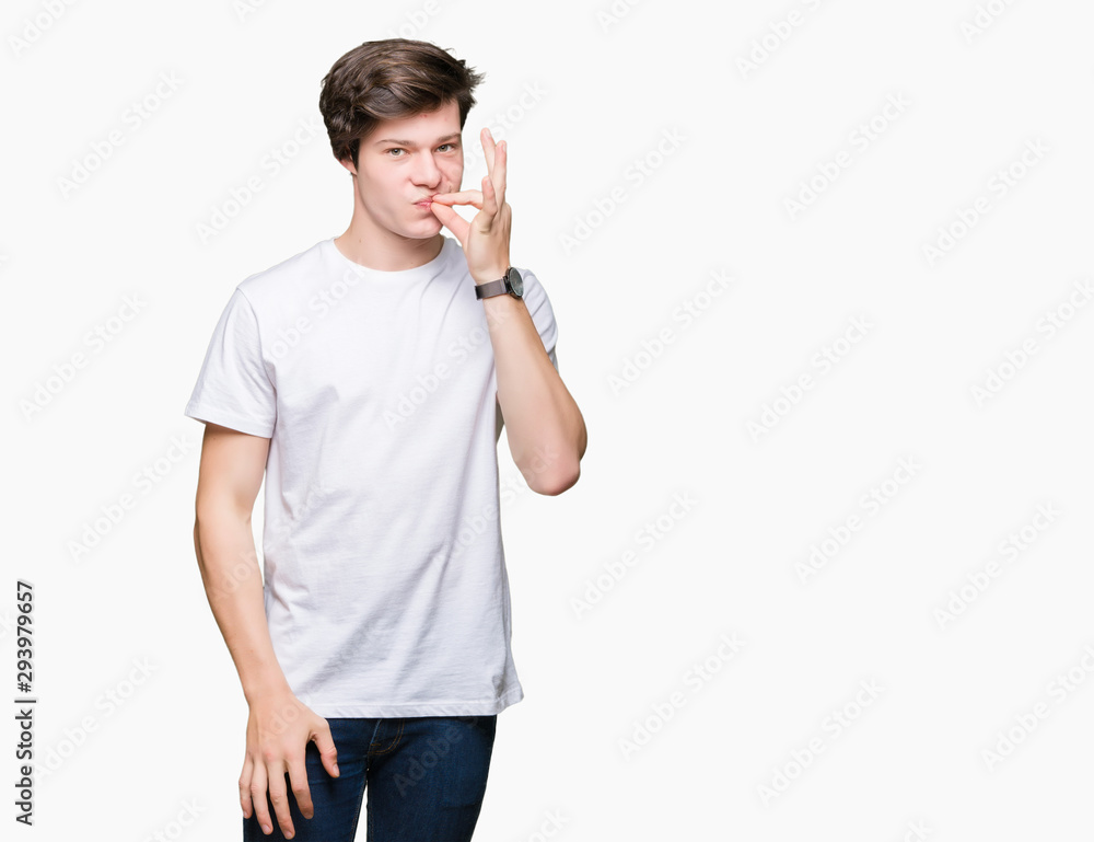 Young handsome man wearing casual white t-shirt over isolated background mouth and lips shut as zip with fingers. Secret and silent, taboo talking Young handsome man wearing casual white t-shirt over isolated background mouth and lips shut as zip with fingers. Secret and silent, taboo talking