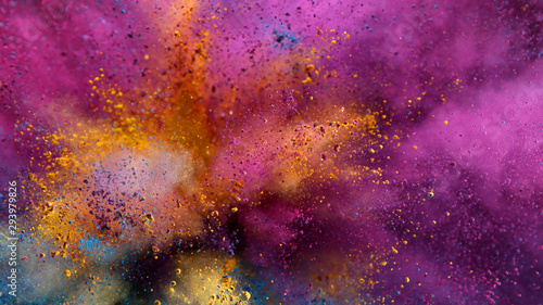 Explosion of colored powder on black background