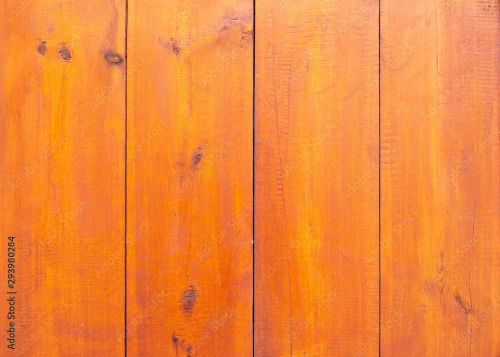 Wooden background of red-brown boards. Table made of natural boards covered with stain and varnish. Wooden background of red-brown boards. Table made of natural boards covered with stain and varnish.