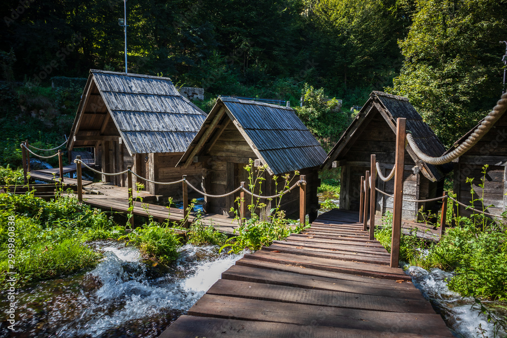 Old small wooden water mills called Mlincici by the Pliva lakes near the Jajce town in Bosnia and Herzegovina Old small wooden water mills called Mlincici by the Pliva lakes near the Jajce town in Bosnia and Herzegovina
