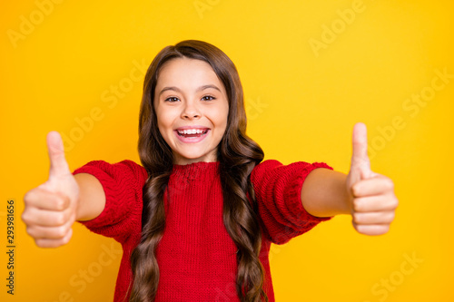 Close up photo of positive cheerful emotion funky kid show thumb up enjoy ads give feedback choice decisions recommend promo wear style lifestyle jumper isolated over yellow color background