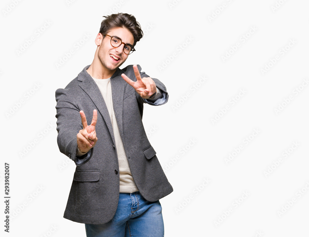 Young business man wearing glasses over isolated background smiling looking to the camera showing fingers doing victory sign. Number two. Young business man wearing glasses over isolated background smiling looking to the camera showing fingers doing victory sign. Number two.