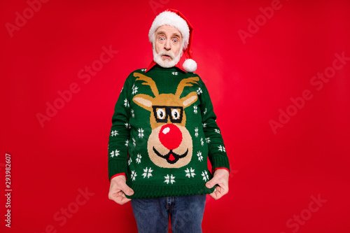 Bild auf Leinwand Photo of santa granddad showing ugly deer ornament pullover dressed on himself n