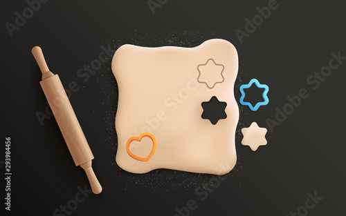 Isolated rolled cookie dough with cute heart and star cookie cutter shapes