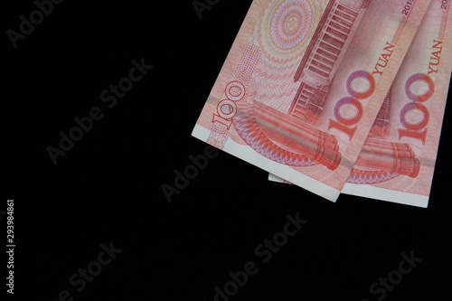 banknotes of Chinese currency on black background