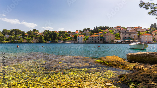 Fishing boats in Splitska village with beautiful port, Brac island, Croatia. Village of Splitska on Brac island seafront view, Dalmatia, Croatia, Croatia. photo