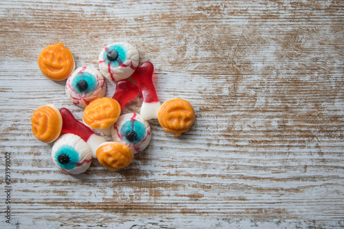 Halloween sweets on wooden surface