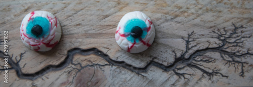 Halloween eyes on a wooden surface