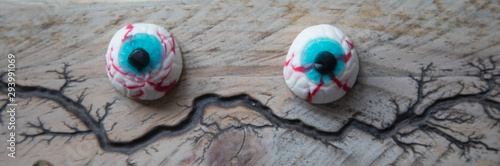 Halloween eyes on a wooden surface