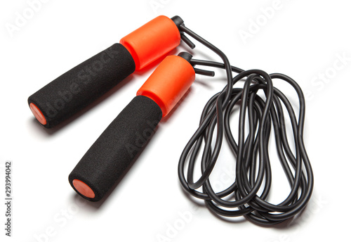 Jump rope. Fun exercises for body health. Orange rope with black cord. Isolated on white background