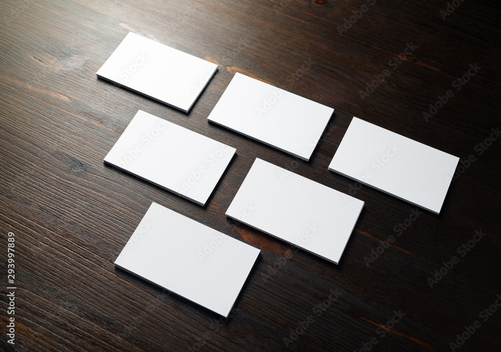 Photo of blank business cards on a wooden background. Template for ID. Photo of blank business cards on a wooden background. Template for ID.