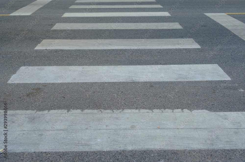 Crosswalk sign on the street for safty people for across the street. Crosswalk sign on the street for safty people for across the street.