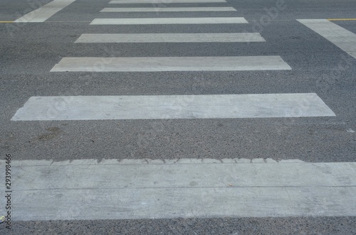 Crosswalk sign on the street for safty people for across the street.