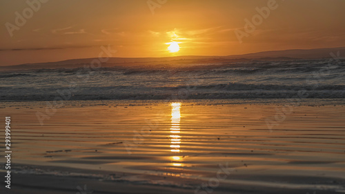 Orange sunset over Enniscrone Beach, Ireland.