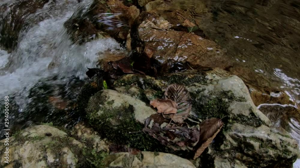4K Small stream natural dam in pristine Alps valley 4K Small stream natural dam in pristine Alps valley