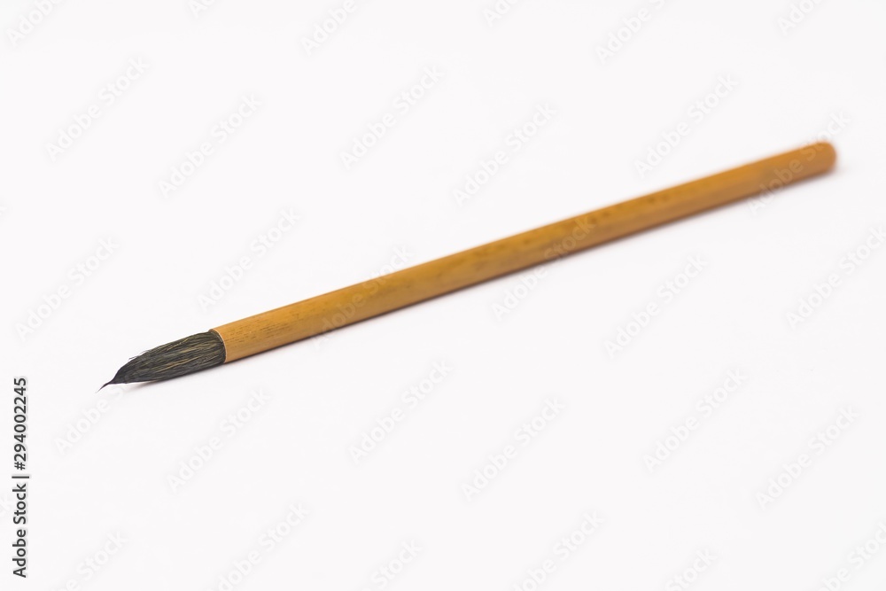 Calligraphy brush isolated against white Calligraphy brush isolated against white