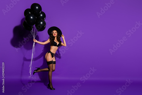 Full length body size view of her she nice attractive cheerful glad wavy-haired lady holding in hands air ball enjoying isolated on bright vivid shine vibrant violet purple lilac color background