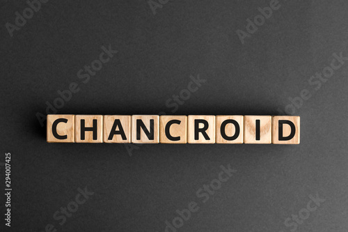 Chancroid - word from wooden blocks with letters, a venereal infection chancroid concept, grey background
