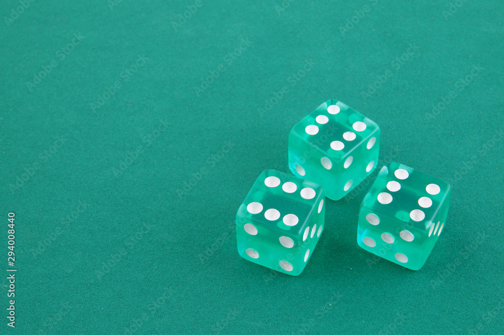Three dices on green gaming table, gambling concept Three dices on green gaming table, gambling concept