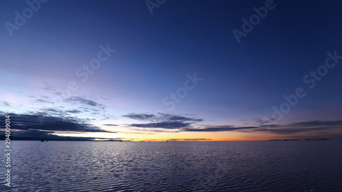 Sunrise in the Salar de Uyuni flooded after the rains, Bolivia. Clouds reflected in the water of the Salar de Uyuni, Bolivia © Marco Ramerini