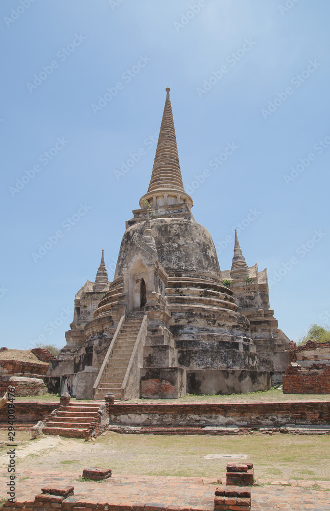 Asian religious architecture. Ancient pagoda at Wat Phra Sri Sanphet temple under blue sky. Ayutthaya, Thailand