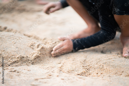 Little asian girl playing on the beach.Vacation and relax concept.