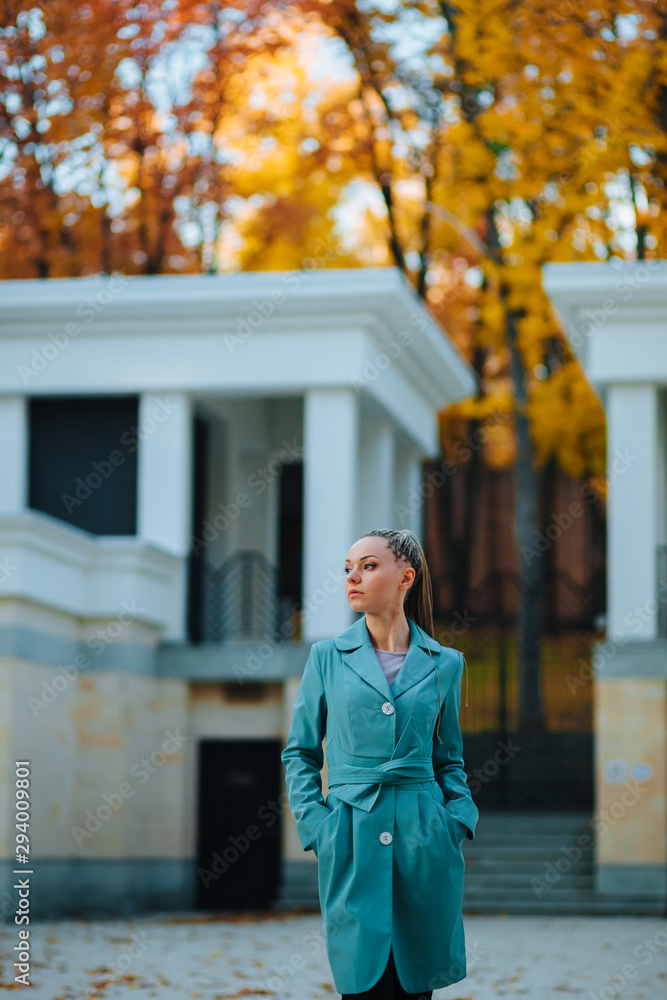 Fototapeta premium The girl walks in autumn