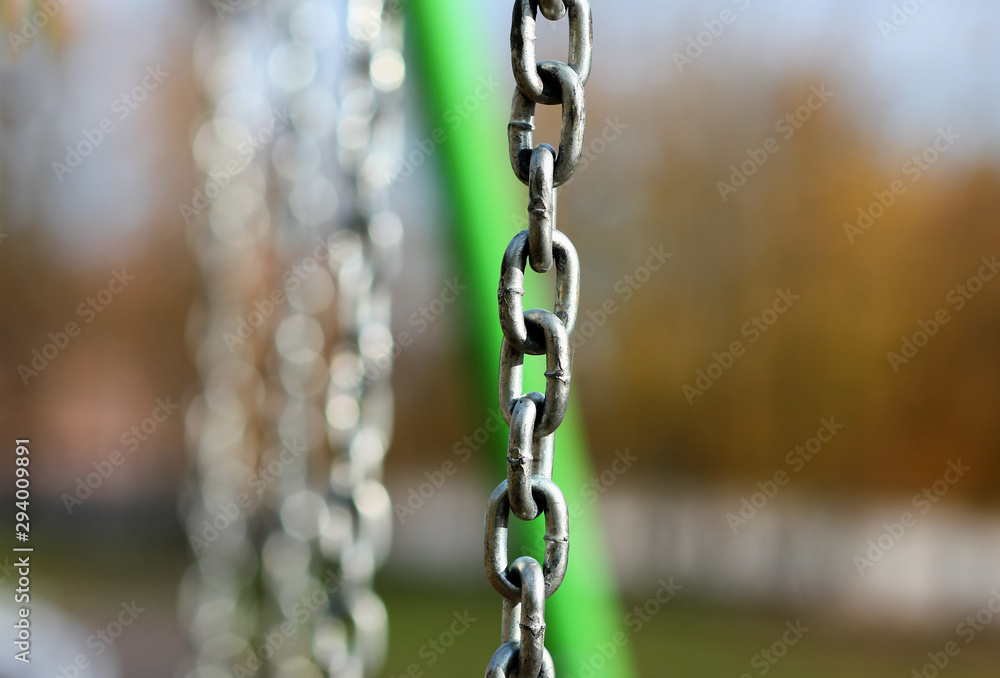 metal chains on the playground closeup metal chains on the playground closeup