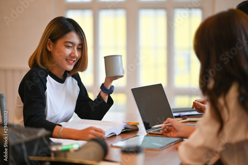Woman together tutoring in campus university room with young woman and 30s woman with education concept..