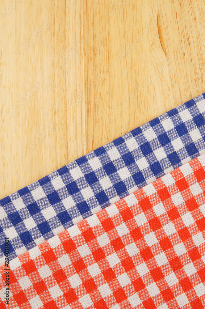 Red and blue tablecloth on wooden table Red and blue tablecloth on wooden table