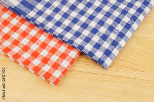Red and blue tablecloth on wooden table