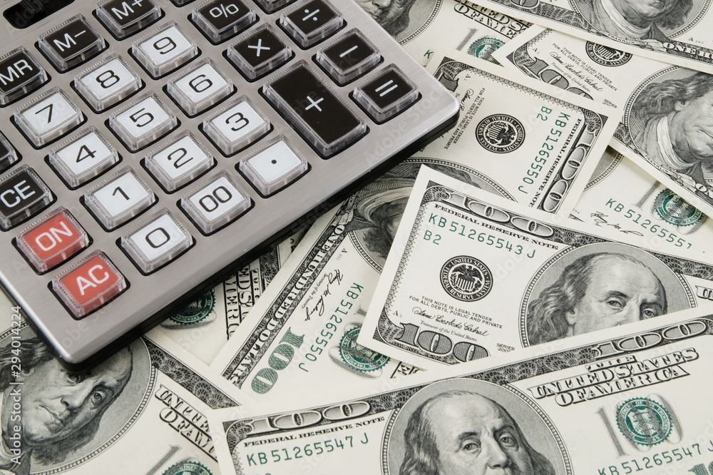 Business concept, calculator on money background Business concept, calculator on money background