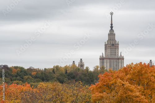 Moscow autumn. View at Moscow State University towering over the autumn forest.  Moscow, Russia.