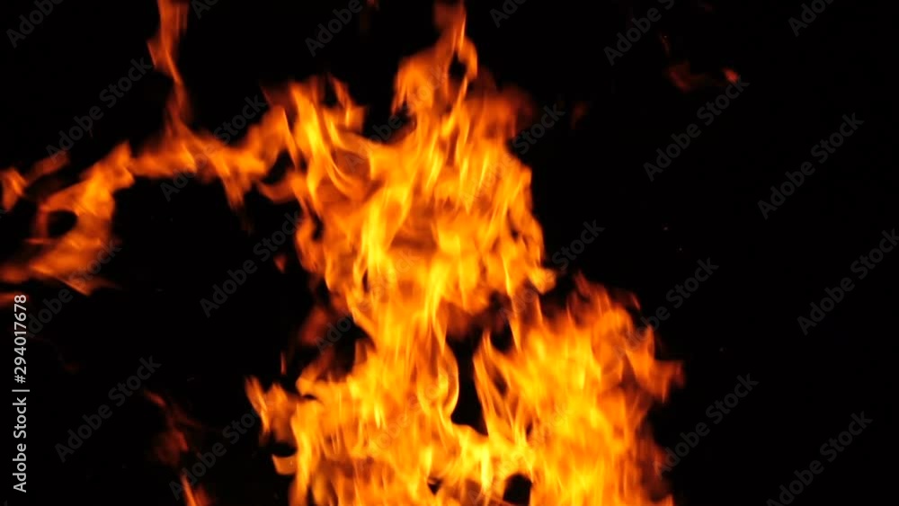 Burning fire at night, slow motion shooting. Flames of fire close-up. Burning fire at night, slow motion shooting. Flames of fire close-up.