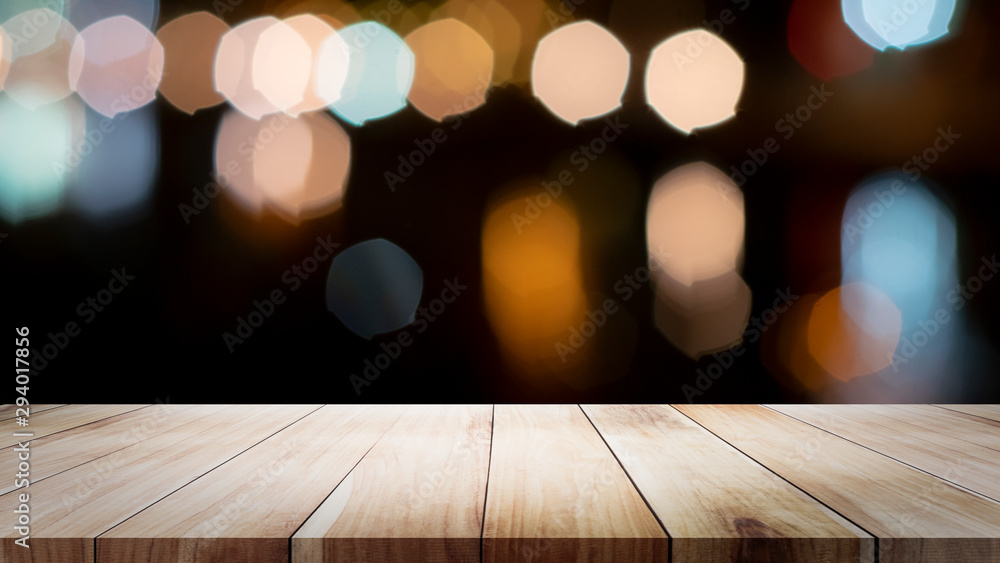 Wooden table with blur background of coffee shop. Wooden table with blur background of coffee shop.