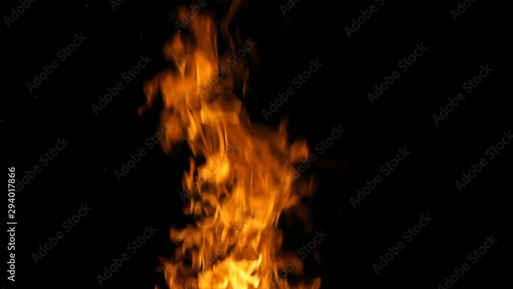Burning fire at night, slow motion shooting. Flames of fire close-up. Burning fire at night, slow motion shooting. Flames of fire close-up.