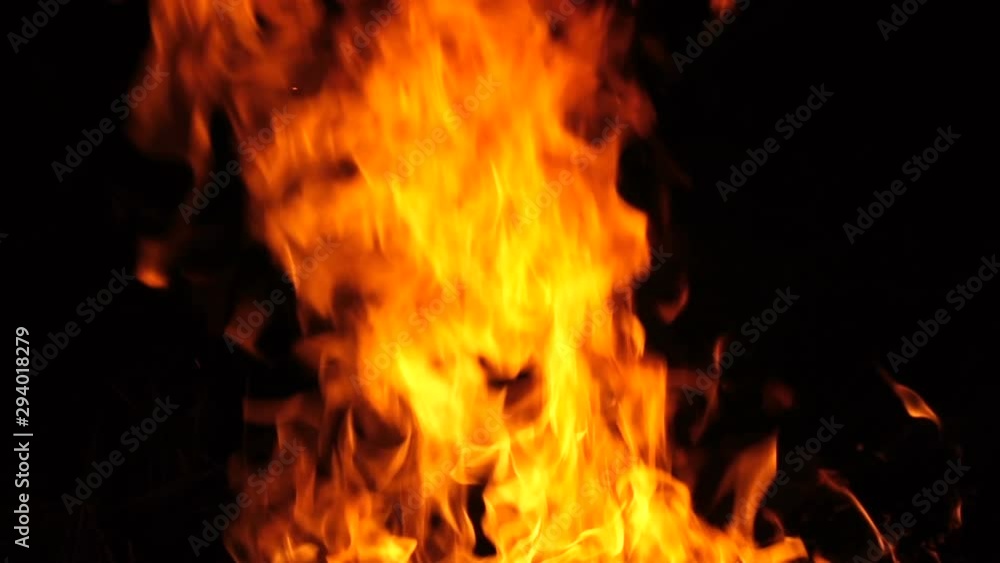 Burning fire at night, slow motion shooting. Flames of fire close-up. Burning fire at night, slow motion shooting. Flames of fire close-up.