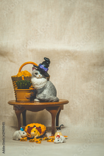 halloween holiday decoration concept, A lot of halloween party object miniature toys decoration on wrinkled calico background.