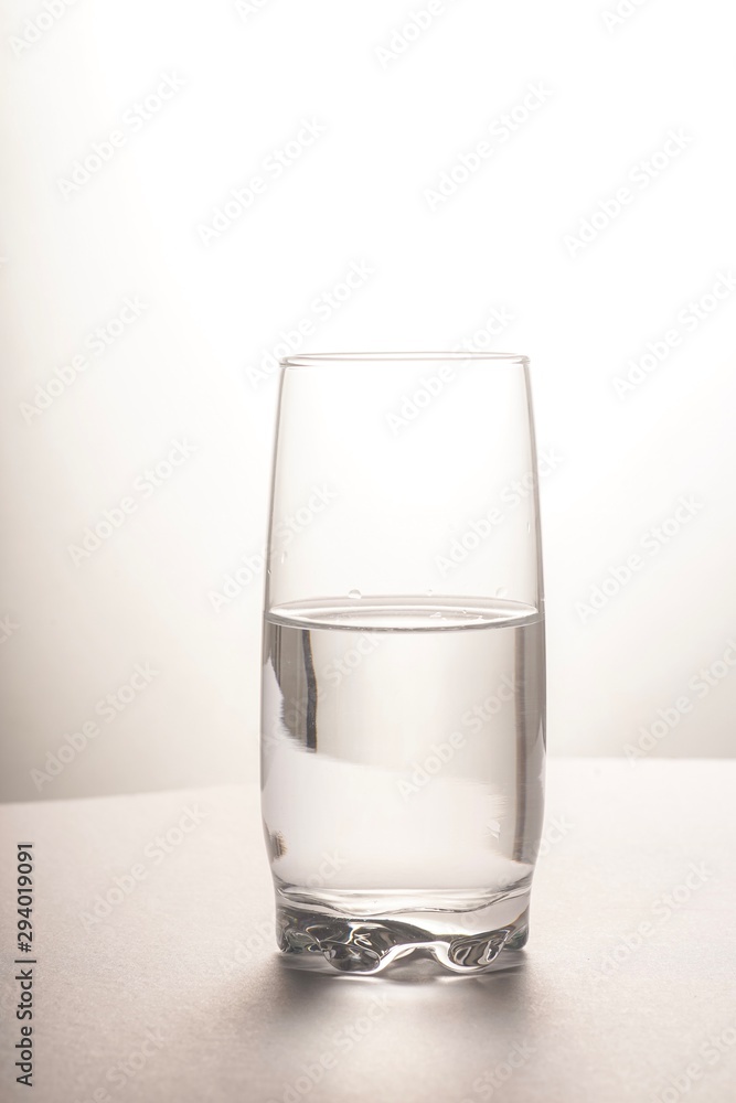 Glass half empty or glass half full. Psychology or motivational concept Glass half empty or glass half full. Psychology or motivational concept