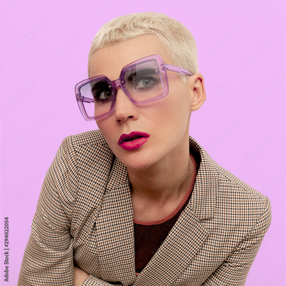 Blonde with short hair in fashionable glasses. Vintage style