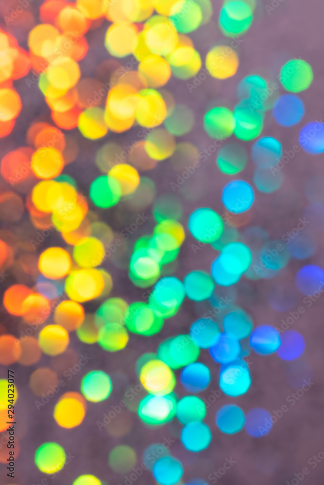 Colorful prism confetti blurred festive backdrop, trendy sparkles and glitter background, flat lay style. Christmas and holidays concept