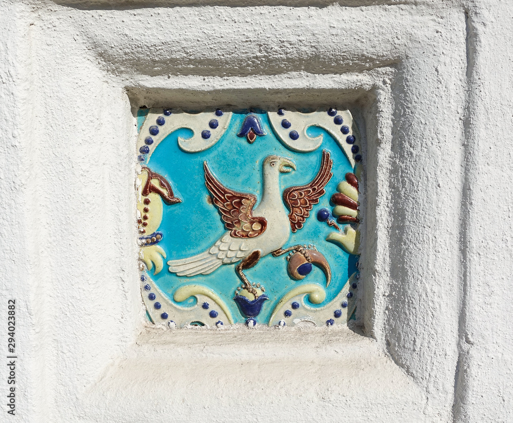 Image of a bird on ceramic tile. Ancient decoration of the ancient orthodox church.