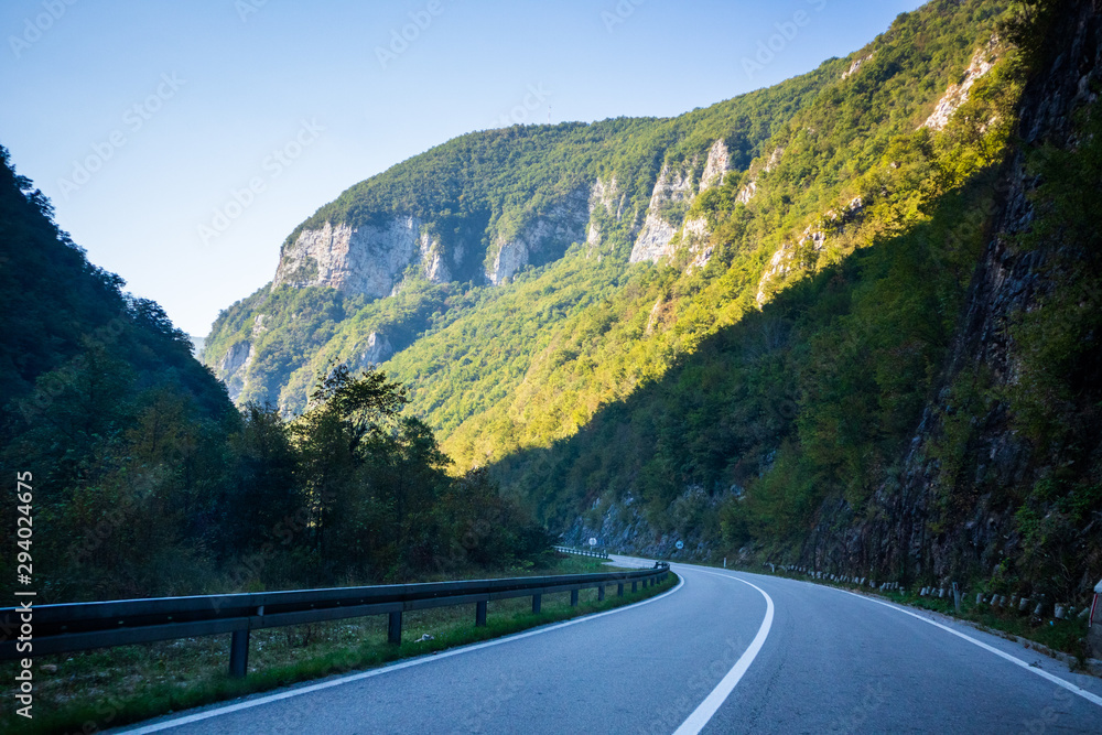 Asphalt road by the mountain in canyon of the Vrbas river near the Banja Luka in Bosnia and Herzegovina