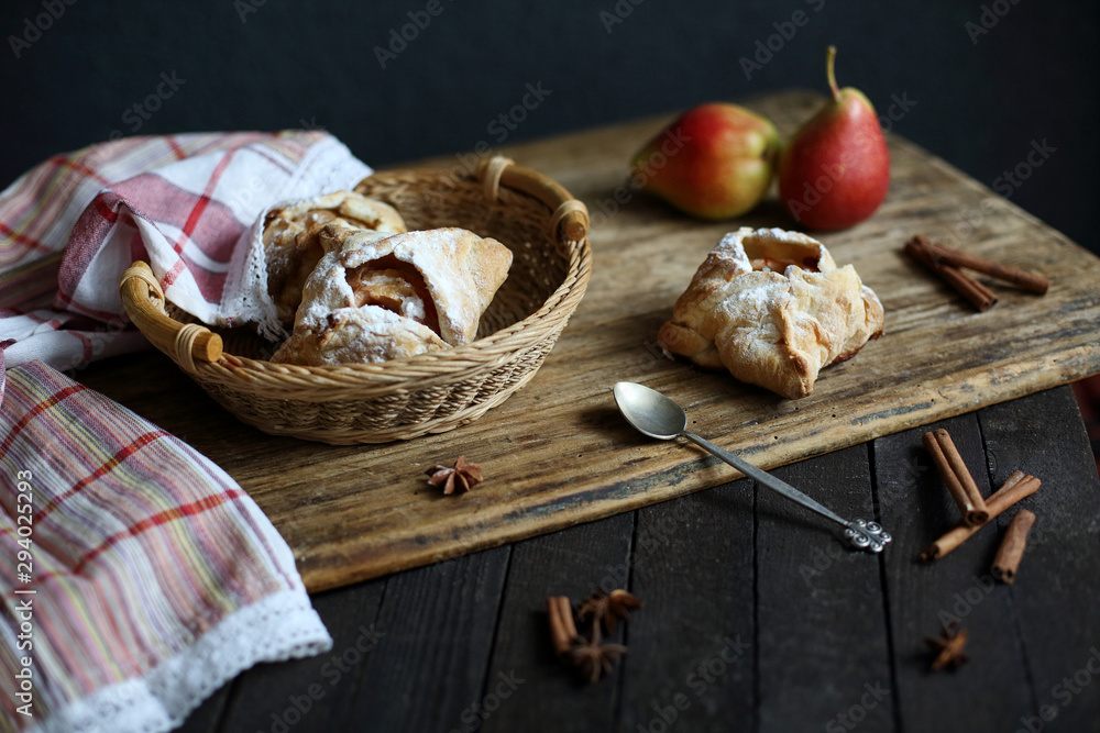 puff pastry with Apple on dark wooden background.
