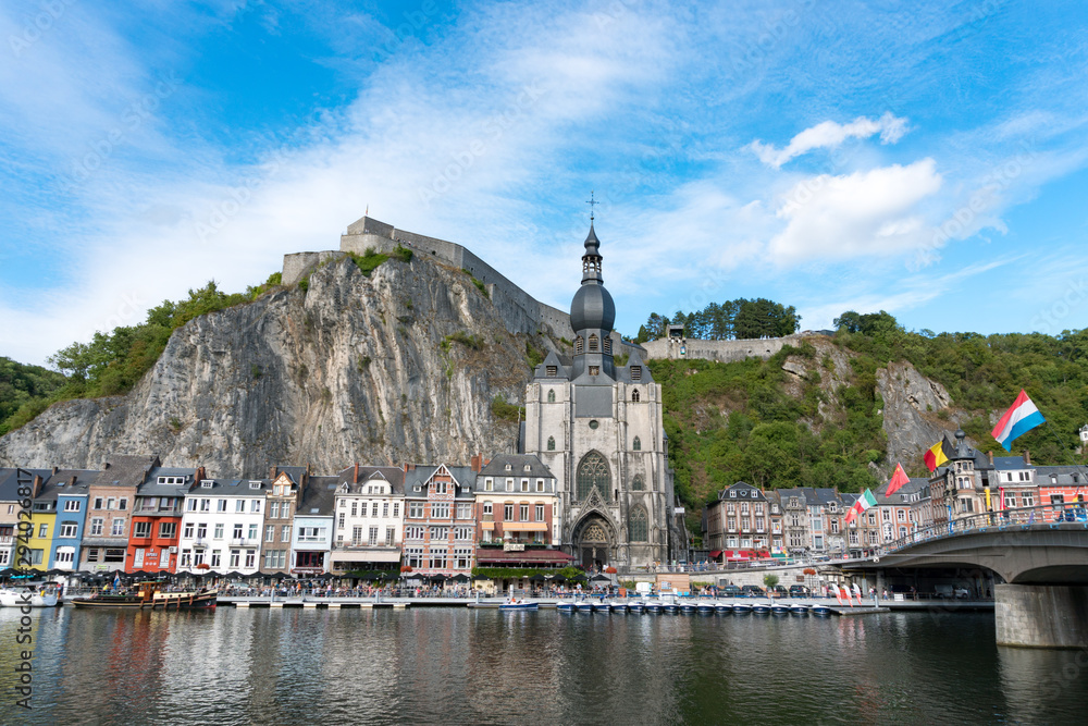 view of the small town of Dinant with Maas river and citadel and cathedral in the old town