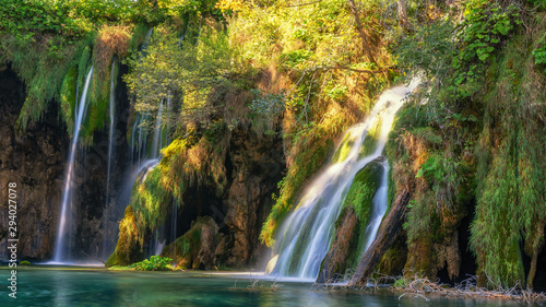 Breathtaking waterfalls panorama in Plitvice Lakes National Park  Croatia  Europe. Majestic view with turquoise water and sunset sunny beams  travel destinations background