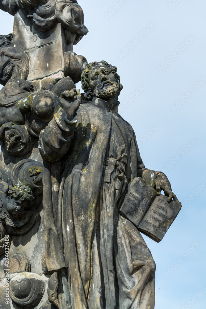 A statue of Saint Cajetan, holding a book at the Charles bridge, Prague. Czech repulic. A statue of Saint Cajetan, holding a book at the Charles bridge, Prague. Czech repulic.