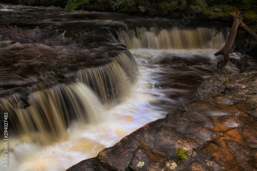 The horseshoe falls, Sgwd y Bedol, at Sgwd Ddwli on the river Neath, near Pontneddfechan in South Wales, UK. photo